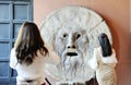 Beautiful asian women photograph each other in front of the mouth of truth Bocca della VeritÃÂ . Church of Santa Maria in Royalty Free Stock Photo